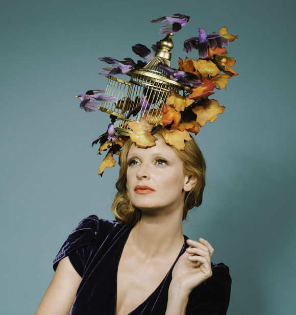 A birdcage headpiece combining autumn leaves, lilac birds and a golden birdcage