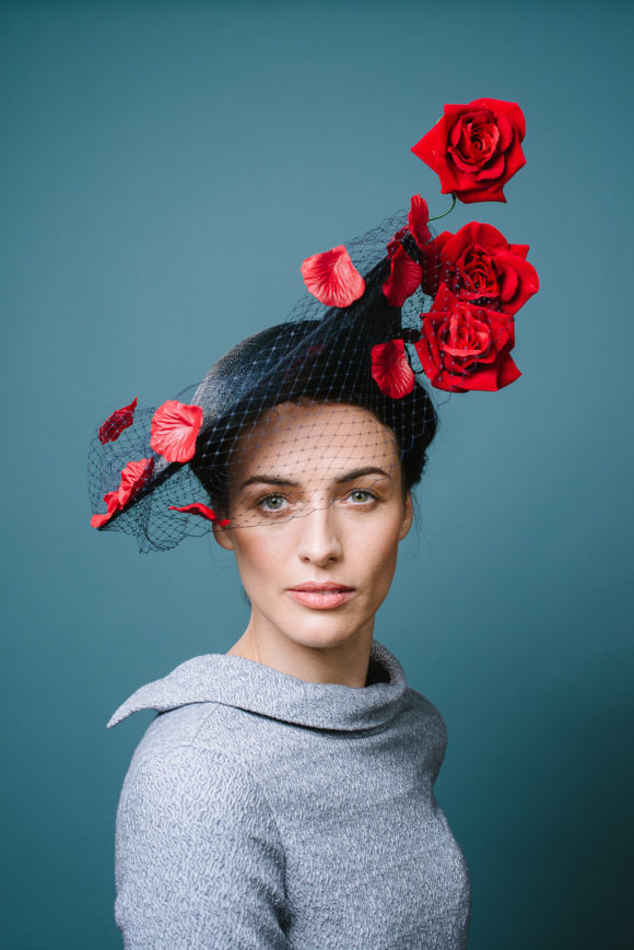 Red roses and navy tilted saucer